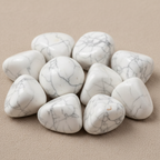 Close-up of smooth polished Howlite tumble stones with natural grey veining